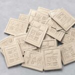 Blind Debossed Cream Leather Clothing Labels
